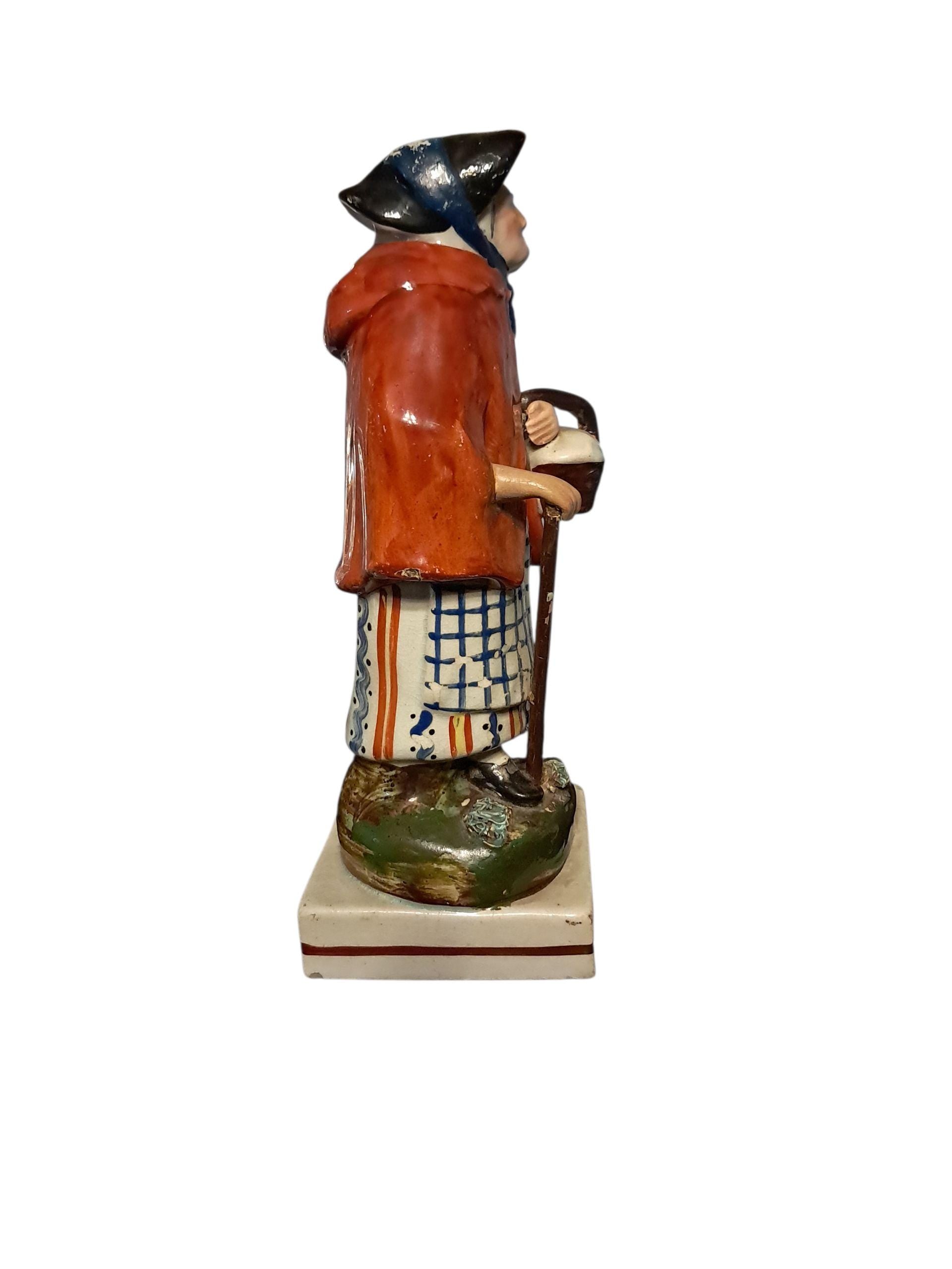 Earlier Staffordshire Figure of Old Age